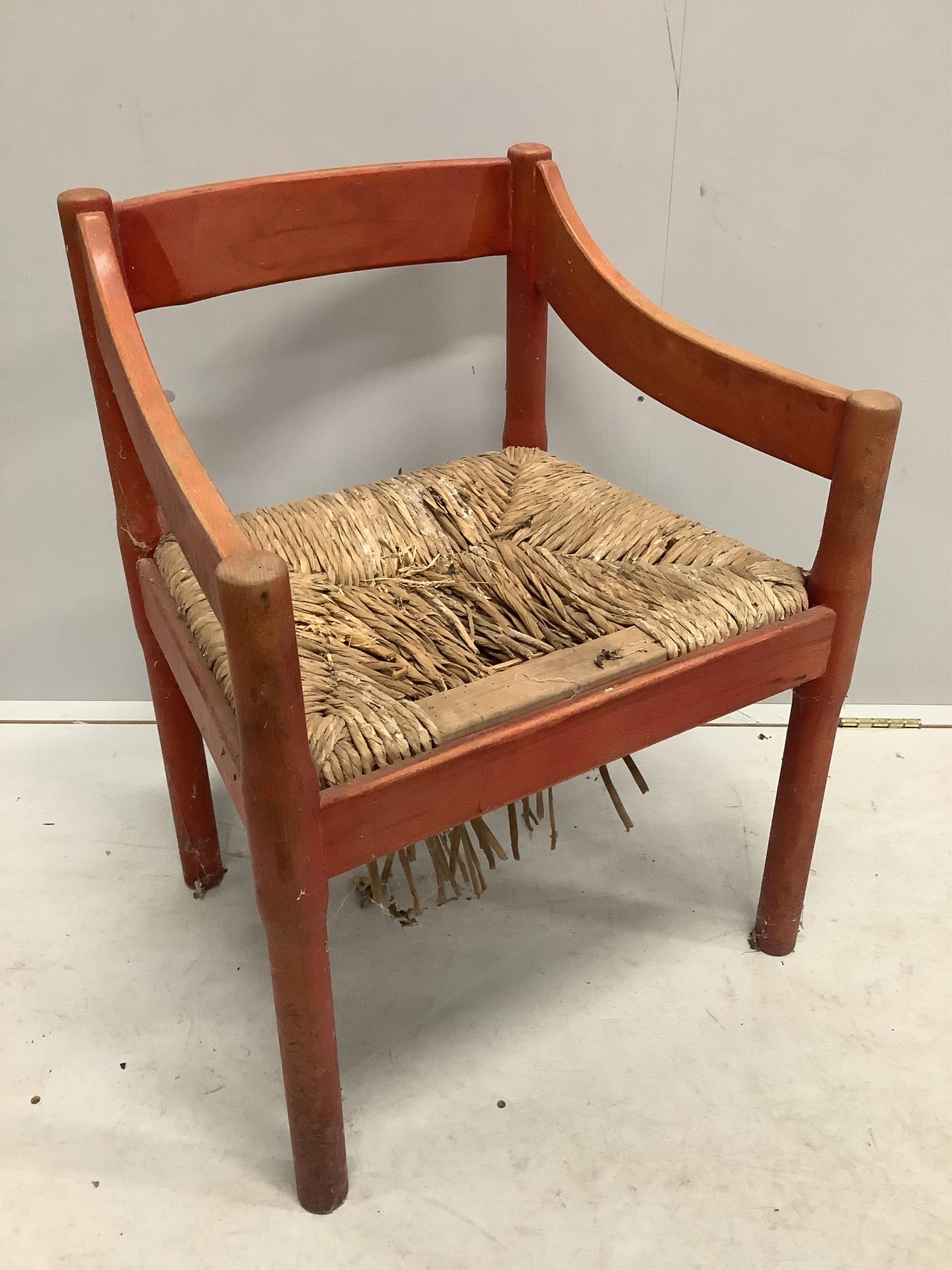 An early Habitat Magistretti style red stained beech settee, width 198cm, depth 84cm, height 69cm and a matching elbow chair. Condition - poor to fair